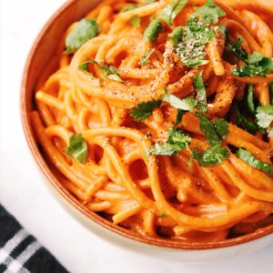 mix in the creamy red pepper sauce and enjoy with a garnish of fresh basil.